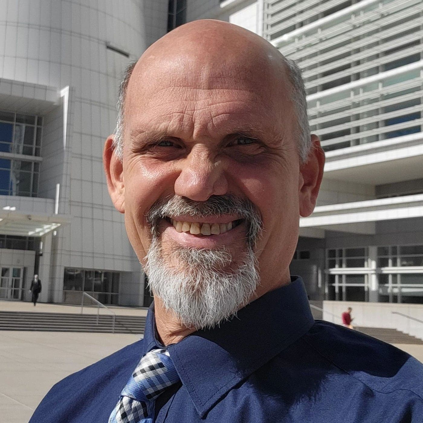 Portrait of Dr. Russ L'HommeDieu smiling outdoors.